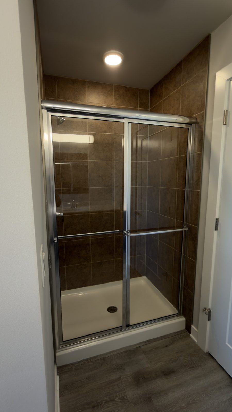 Tile shower detailed after construction cleaning