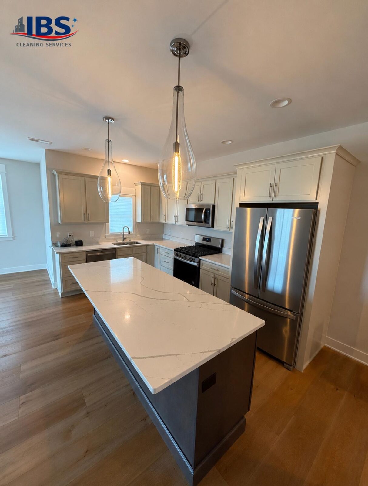 Kitchen island with quartz countertop cleaned by IBS Cleaning Services in Madison, WI