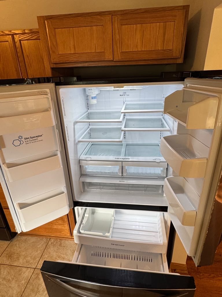 Refrigerator interior cleaned during a move-out