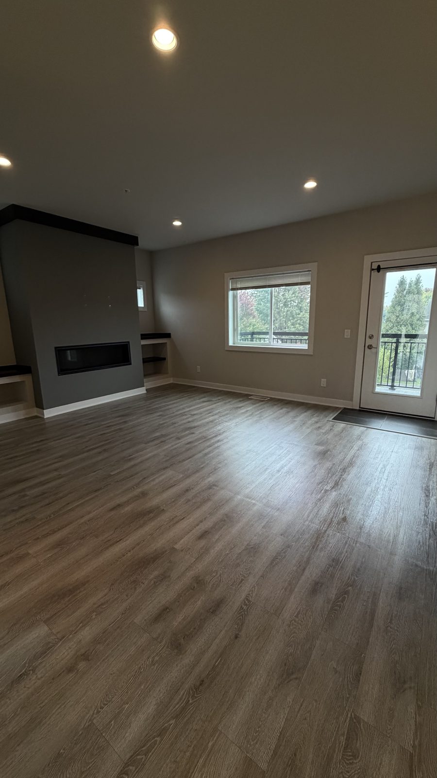 New living room with fireplace after final construction cleaning