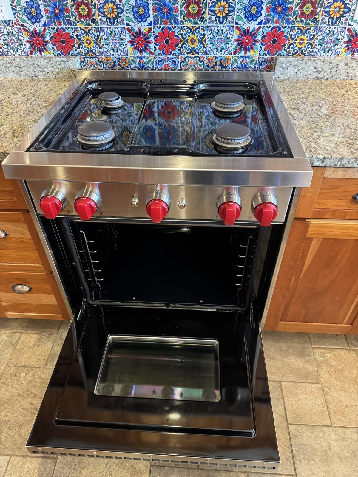 Range and cooktop detailed during deep cleaning